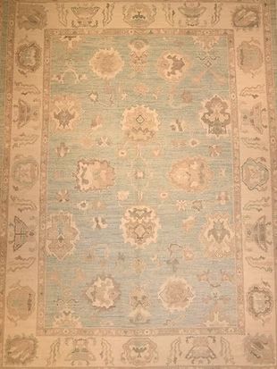 A rug with a floral pattern on it is sitting on a table.