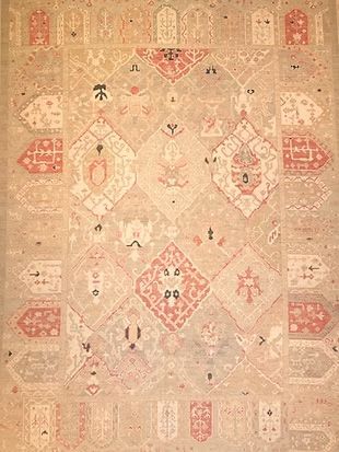 A close up of a rug with a pattern on it.