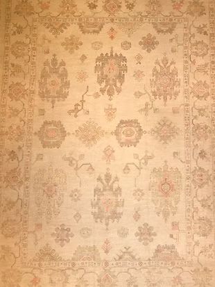 A rug with a floral pattern on it is sitting on a table.