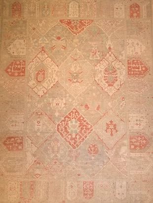 A close up of a rug with a pattern on it.