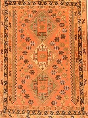 A rug with a pattern on it is sitting on a table.