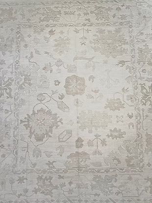 A close up of a rug with a floral pattern on it.