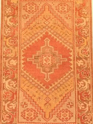 A close up of a rug with a geometric pattern on it.