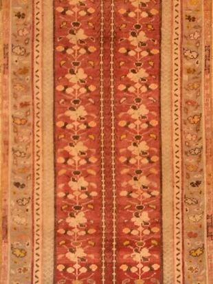 A close up of a rug with a floral pattern on it