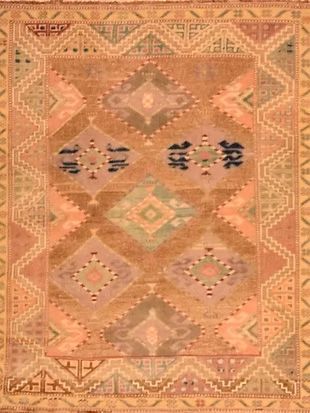 A close up of a rug with a geometric pattern on it.