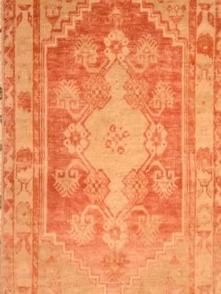 A close up of a rug with a pattern on it