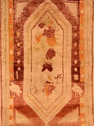 A close up of a rug with a geometric pattern on it.