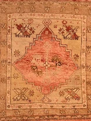 A close up of a rug with a geometric pattern on it.