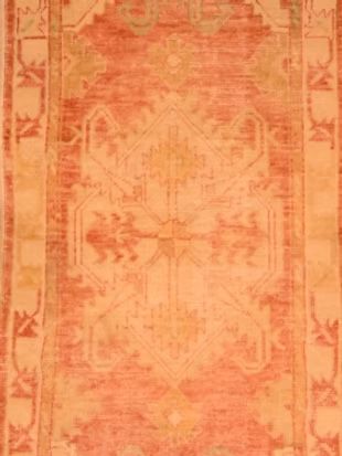 A close up of a rug with a pattern on it.