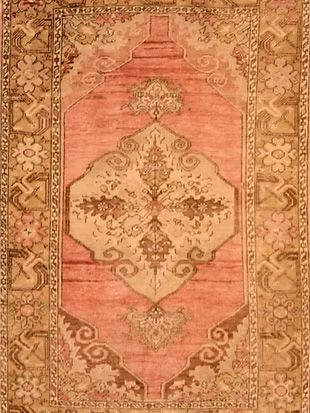 A close up of a rug with a floral pattern on it.