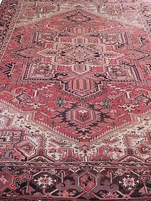 A close up of a rug with a pattern on it.