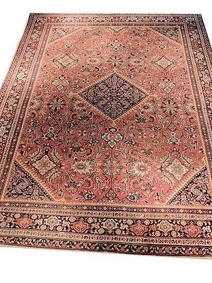 A large rug is sitting on top of a white surface.