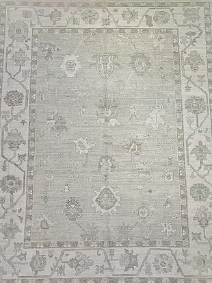 A close up of a rug with a floral pattern on it.