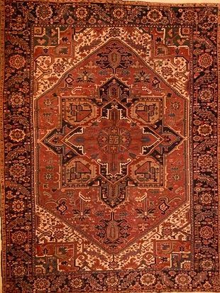 A rug with a pattern on it is sitting on a table.