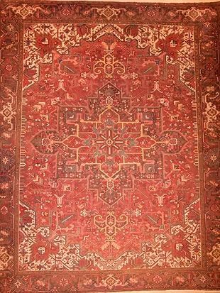 A close up of a red rug with a pattern on it.