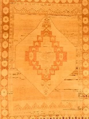 A close up of a rug with a geometric pattern on it.