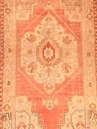 A close up of a rug with a pattern on it.