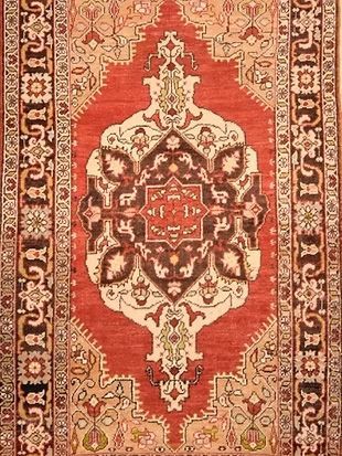 A close up of a rug with a pattern on it.