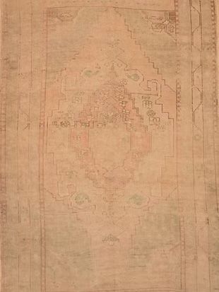 A close up of a rug with a pattern on it.