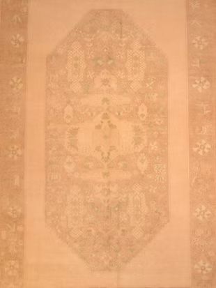 A close up of a rug with a floral pattern on it.