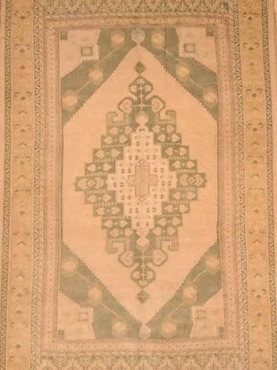 A rug with a pattern on it is sitting on a table.