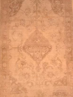 A close up of a rug with a pattern on it.