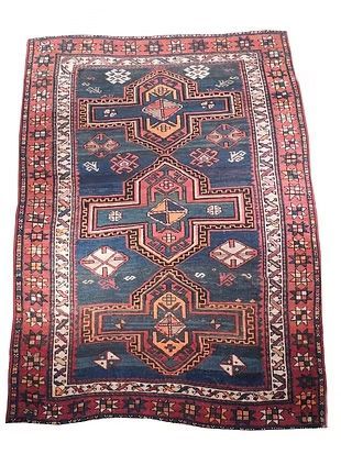 A rug with a blue and red pattern on it