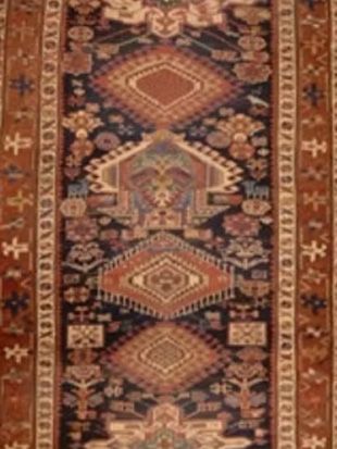 A close up of a rug with a pattern on it