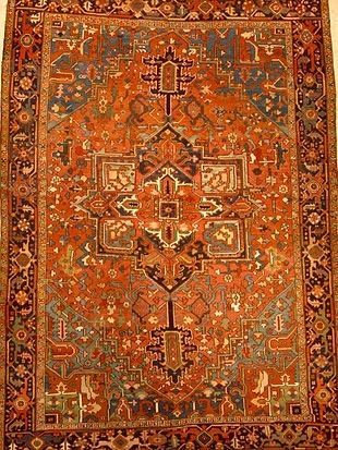 A close up of a rug with a pattern on it.