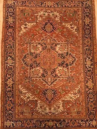 A rug with a pattern on it is sitting on a table.