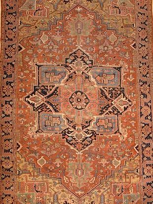 A close up of a rug with a pattern on it.