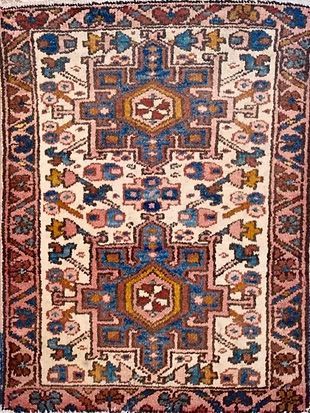 A close up of a rug with a floral pattern on it.