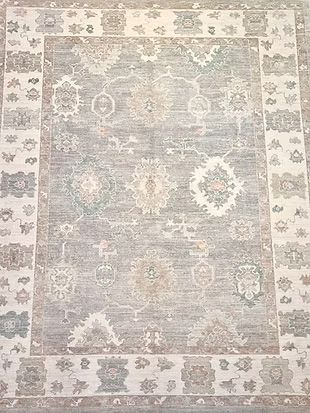 A close up of a rug with a floral pattern on it.