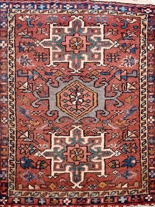 A close up of a rug with a geometric pattern on it.