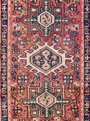 A close up of a rug with a pattern on it.