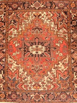 A close up of a rug with a floral pattern on it.