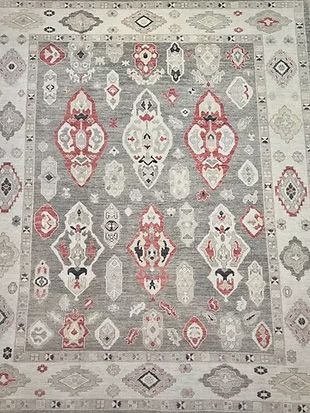 A rug with a pattern on it is sitting on a table.