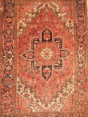 A close up of a rug with a pattern on it.