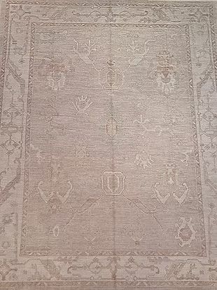 A rug with a pattern on it is sitting on a table.