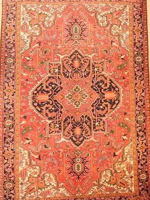 A close up of a rug with a pattern on it.