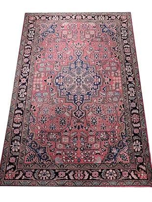 A close up of a rug on a white background.