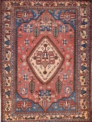 A close up of a rug with a floral pattern on it.