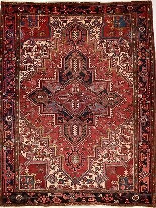 A close up of a rug with a floral pattern on it.