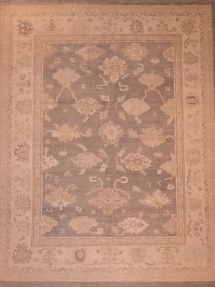 A rug with a floral pattern on it is sitting on a table.