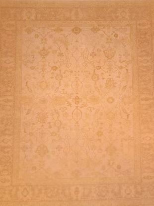 A close up of a rug with a floral pattern on it.