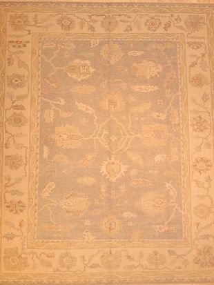 A rug with a floral pattern on it is sitting on a table.