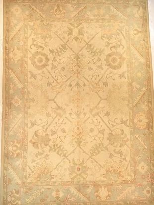 A rug with a floral pattern on it is sitting on a table.