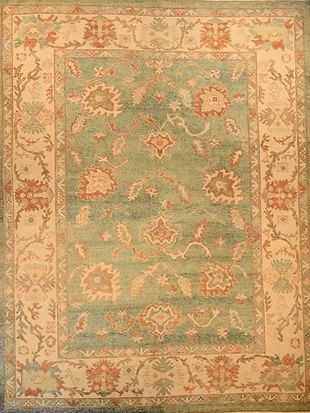 A rug with a floral pattern on it is sitting on a table.