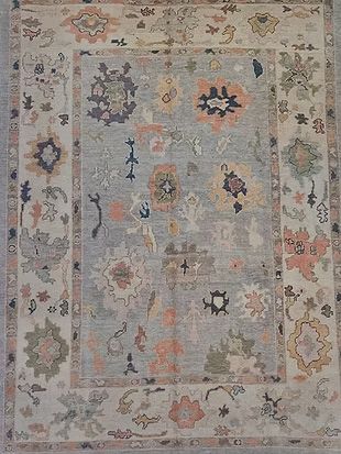 A rug with a floral pattern on it is sitting on a table.