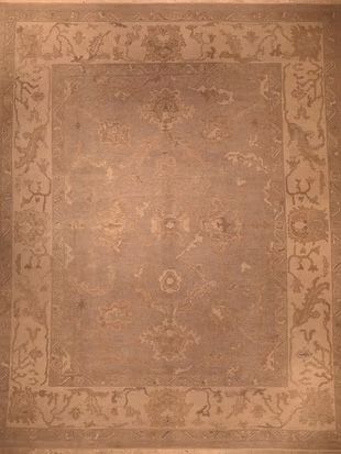 A close up of a rug with a floral pattern on it.